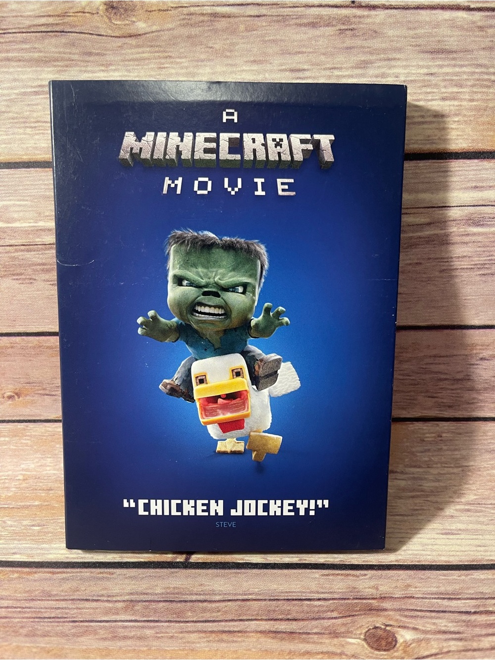Warner Bros. Minecraft Movie Cover - Blue with Green Character